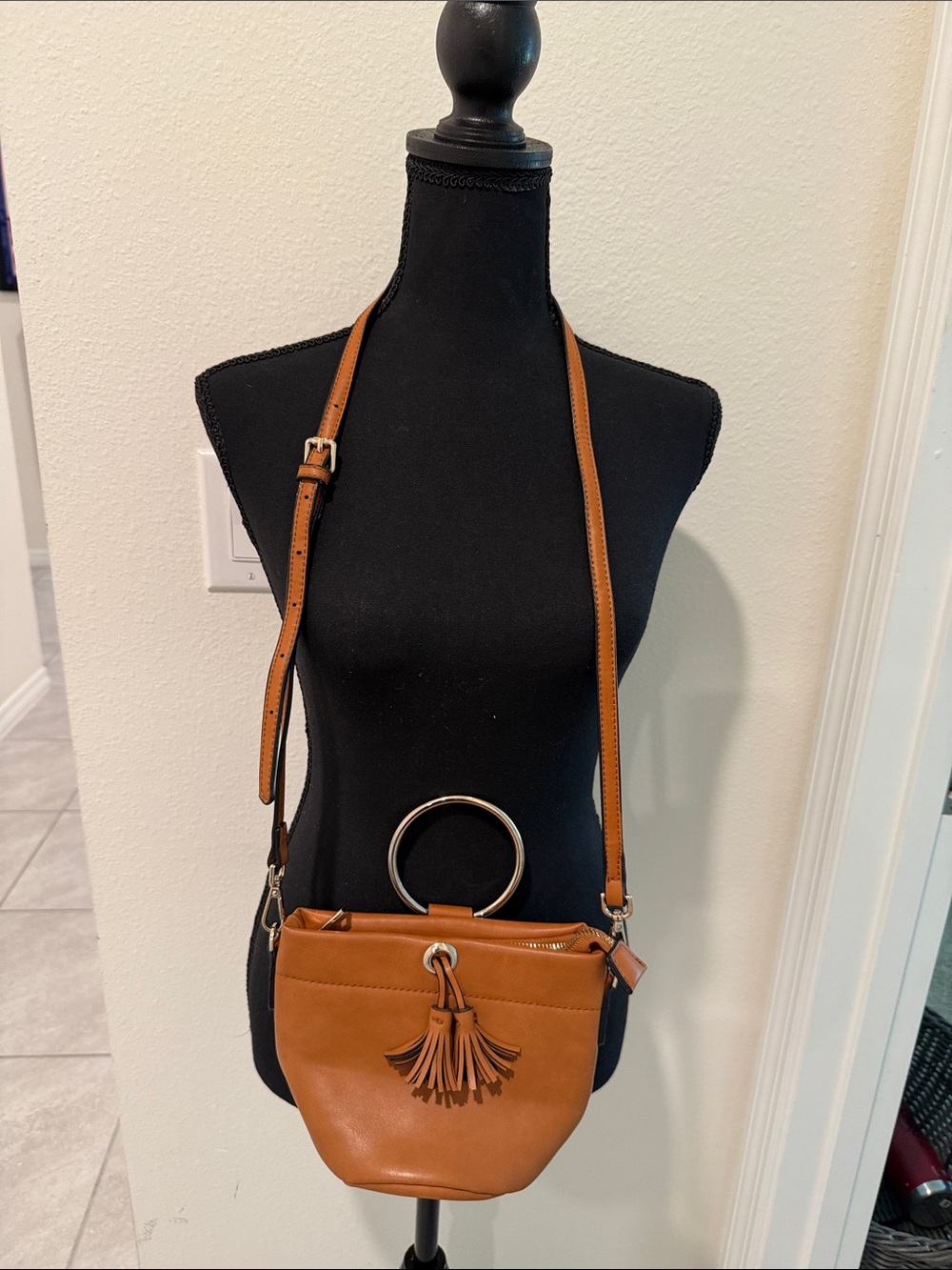 Expressions Tan Crossbody Bag w/Tassel. Removable strap.  Gold ring for wristlet